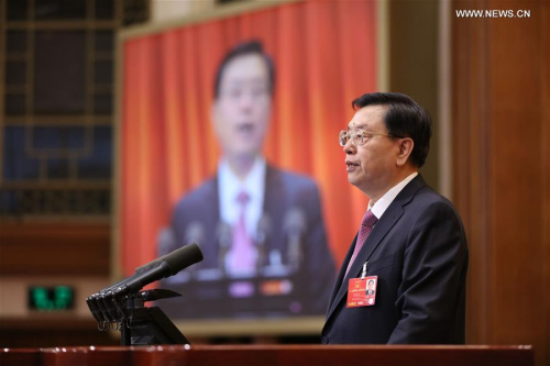 Zhang Dejiang, chairman of the Standing Committee of China's National People's Congress (NPC), delivers a report on the work of the NPC Standing Committee during the second plenary meeting of the fourth session of the 12th NPC at the Great Hall of the People in Beijing, capital of China, March 9, 2016. (Xinhua/Ju Peng)