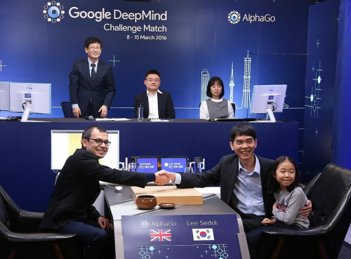 South Korea's Lee Sedol, the world's top Go player, right, together with his daughter, and Demis Hassabis, the CEO of DeepMind Technologies and developer of AlphaGO, pose for photographs ahead of the Google DeepMind Challenge Match in Seoul, South Korea, March 9, 2016. (Photo/Xinhua)