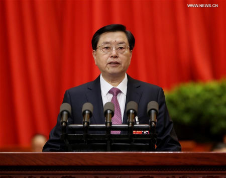  Zhang Dejiang, chairman of the Standing Committee of China's National People's Congress (NPC), delivers a report on the work of the NPC Standing Committee during the second plenary meeting of the fourth session of the 12th NPC at the Great Hall of the People in Beijing, capital of China, March 9, 2016. (Xinhua/Yao Dawei) 
