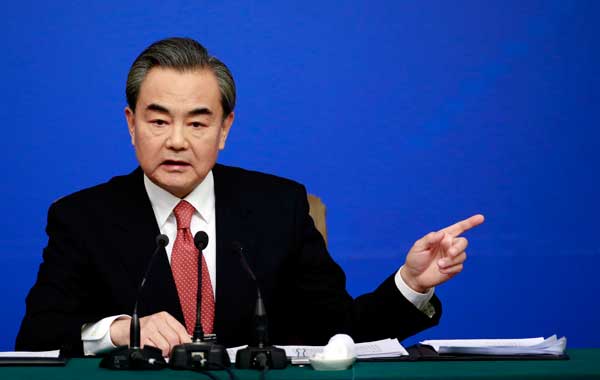 Foreign Minister Wang Yi, speaking about the Korean Peninsula during a wide-ranging news conference on Tuesday. PHOTOS BY FENGYONGBIN/ CHINA DAILY