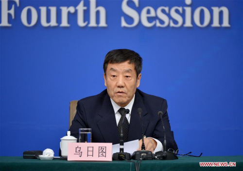 Deputy Director of the National People's Congress (NPC) Finance and Economic Committee Uzhitu answers questions during a press conference about legislation progress on the sidelines of the fourth session of China's 12th NPC in Beijing, capital of China, March 10, 2016. (Xinhua/Li Xin)