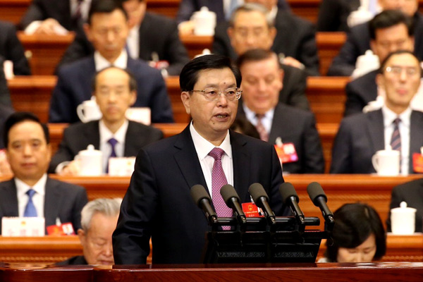 Top legislator Zhang Dejiang delivers the NPC Standing Committee work report at the annual session in Beijing on Wednesday. (Photo by Xu Jingxing/China Daily)