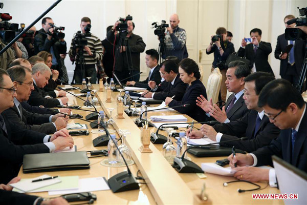Visiting Chinese Foreign Minister Wang Yi (3rd R) holds talks with his Russian counterpart Sergei Lavrov (2nd L) in Moscow, Russia, on March 11, 2016. (Xinhua/Bai Xueqi)