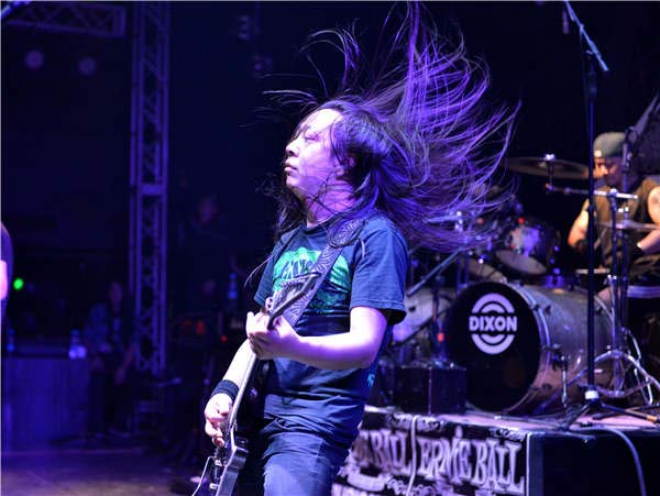 Kou Zhengyu and his band Suffocated perform at the 330 Metal Music Festival in Beijing in 2014. (Photo provided to China Daily)