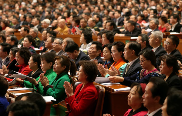 CPPCC members finish their annual session at the Great Hall of the People in Beijing on Monday. (Photo by Zou Hong/China Daily)