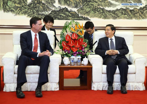 Chinese State Councilor Guo Shengkun (R) meets with Director of U.S. Federal Bureau of Investigation James Comey, in Beijing, capital of China, March 14, 2016. (Photo: Xinhua/Ding Haitao)