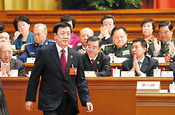 Cao Jianming, prosecutorgeneral at the Supreme People's Procuratorate, prepares to deliver a speech in the Great Hall of the People in Beijing on Sunday. XUJINGXING/CHINADAILY