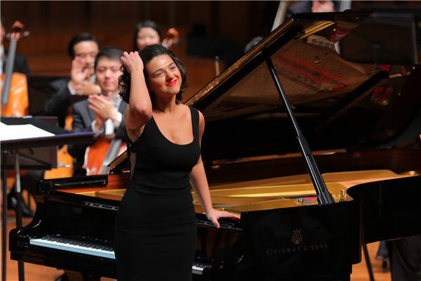 Georgian pianist Khatia Buniatishvili plays with the NCPA Orchestra in Beijing. (Photo: China Daily/Gan Yuan)