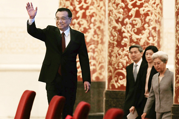 Premier Li Keqiang arrives for the news conference after the closing meeting of the fourth session of China's 12th National People's Congress at the Great Hall of the People in Beijing, March 16, 2016. (Photo by Xu Jingxing/chinadaily.com.cn)