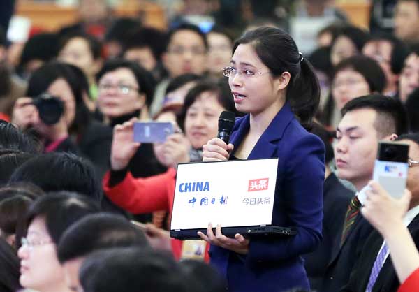 China Daily reporter Wu Jiao asks Premier Li a question at the news conference on Wednesday. Wang Zhuangfei / China Daily