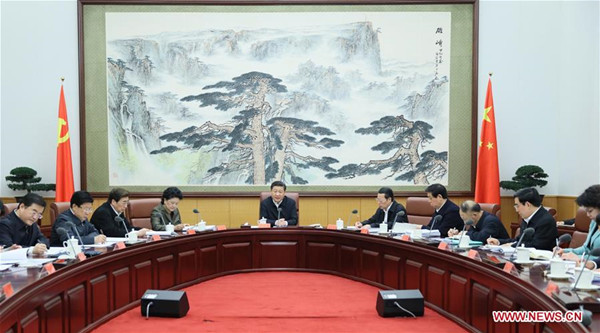 Chinese President Xi Jinping (5th L) speaks after hearing a report on the preparations of the 2022 Beijing Winter Olympic Games and Paralympic Games in Beijing, capital of China, March 18, 2016. (Xinhua/Lan Hongguang)