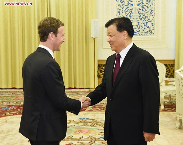 Liu Yunshan (R), a member of the Standing Committee of the Political Bureau of the Communist Party of China (CPC) Central Committee and of the Secretariat of the CPC Central Committee, meets with Mark Zuckerberg, founder and CEO of Facebook, in Beijing, capital of China, March 19, 2016. (Photo: Xinhua/Wang Ye)