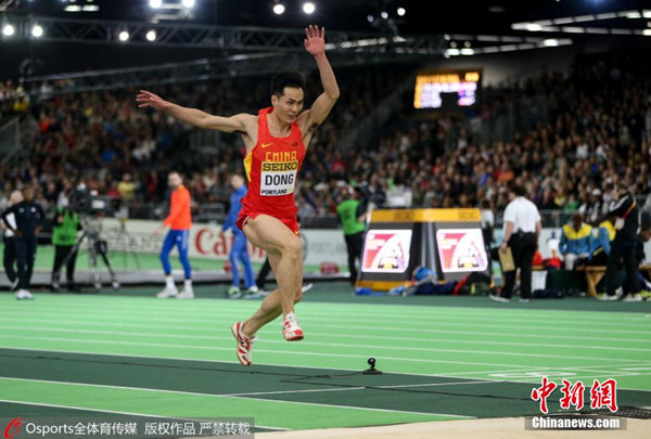 Dong Bin of China jumps at IAAF World Indoor Championships in Portland, March 20, 2016. (Photo/Osports)
