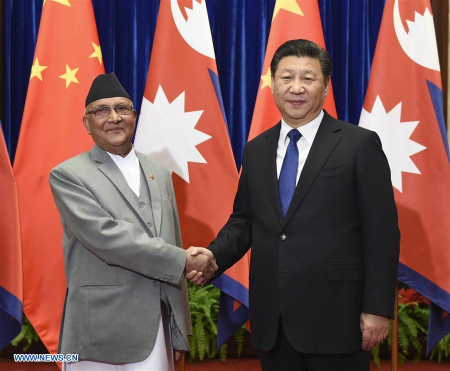 Chinese President Xi Jinping (R) meets with Nepali Prime Minister K. P. Sharma Oli at the Great Hall of the People in Beijing, capital of China, on March 21, 2016. (Xinhua/Xie Huanchi)