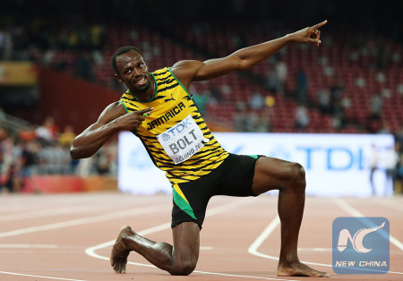 Usain Bolt is celebrating 200m win at Beijing athletics world championships on Aug. 27, 2015. (Xinhua)