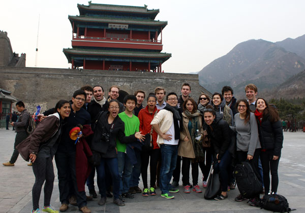 At the end of the trip, Harvard students take a group photo at foot of the Great Wall, Beijing. (Photo: China Daily/Yan Dongjie)