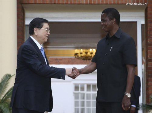 Zhang Dejiang (L), chairman of the Standing Committee of China's National People's Congress (NPC), shakes hands with Zambian President Edgar Lungu in Lusaka, capital of Zambia, March 19, 2016. Zhang paid an official goodwill visit to Zambia on March 18-22. (Xinhua/Ma Zhancheng)