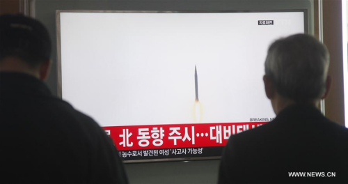 South Koreans watch a report of short-range projectiles fired by the Democratic People's Republic of Korea (DPRK) at Seoul railway station in Seoul, capital of South Korea, on March 21, 2016. The Democratic People's Republic of Korea (DPRK) on Monday fired a total of five short-range projectiles into its eastern waters in an apparent show of force toward the ongoing U.S.-South Korea joint military exercises. (Xinhua/Yao Qilin)