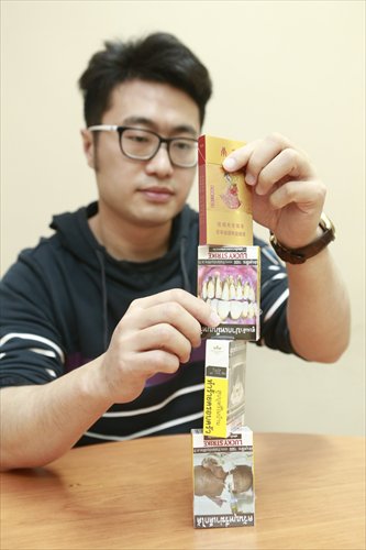 While graphic photos depicting smoking-related diseases have been proven effective deterrents to smoking, China continues to prefer more artistic cigarette packaging. (Photo: Li Hao/GT)