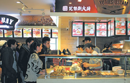Diners stand in line to order food at Yunus Ustam, a halal eatery run by Arman Muslim Foods Industrial Group in Urumqi, Xinjiang. Provided to China Daily