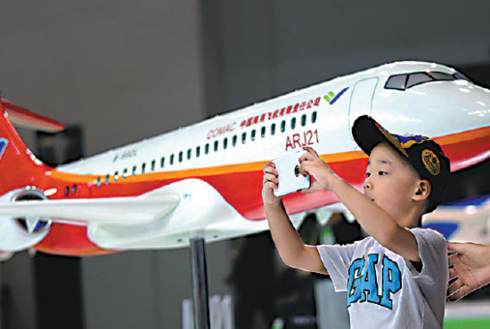 An ARJ21 model on display at the 2015 China Aviation Expo, which opened on Wednesday in Beijing. (Photo: China Daily/Zhang Wei)