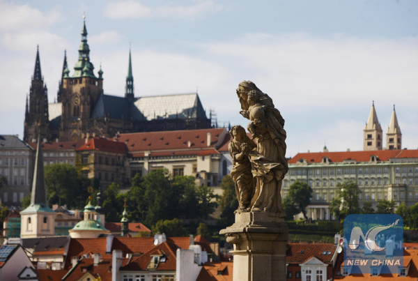 A statue is on the Charles Bridge in downtown Prague, capital of the Czech Republic, on Sept. 1, 2013. (Xinhua/Zhou Lei)