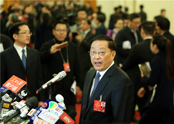 Chen Zhenggao, minister of housing and urban-rural development, receives an interview before the opening meeting of the fourth session of the 12th National People's Congress at the Great Hall of the People in Beijing, capital of China, March 5, 2016. (Photo/Xinhua)