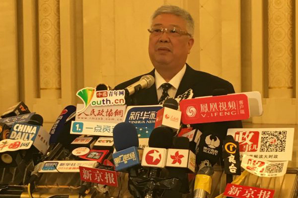 Li Liguo, minister of civil affairs, answers questions during the two sessions, March 9, 2016. (Photo: chinadaily.com.cn/Zheng Jinran)