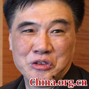 Zhang Xiaoqiang, a member of the 12th National Committee of the Chinese People's Political Consultative Conference (CPPCC) and former vice chairman of the National Development and Reform Commission, speaks to China.org.cn during the ongoing annual session of the top political advisory body on March 9, 2016 in Beijing. (Photo by Zhang Rui / China.org.cn)