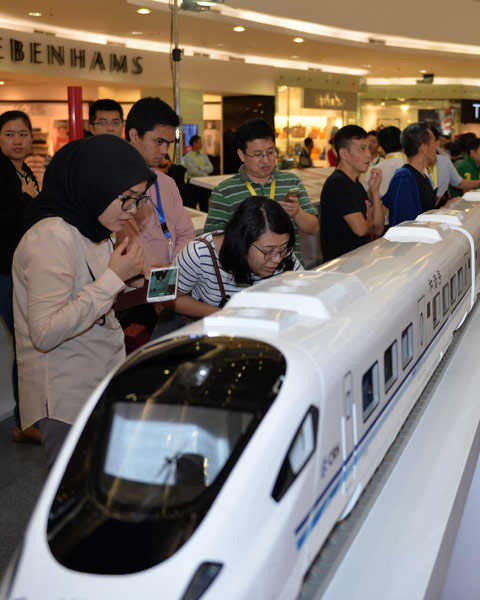 Visitors look at a high-speed train model during an exhibition in Jakarta. (Photo/Xinhua)