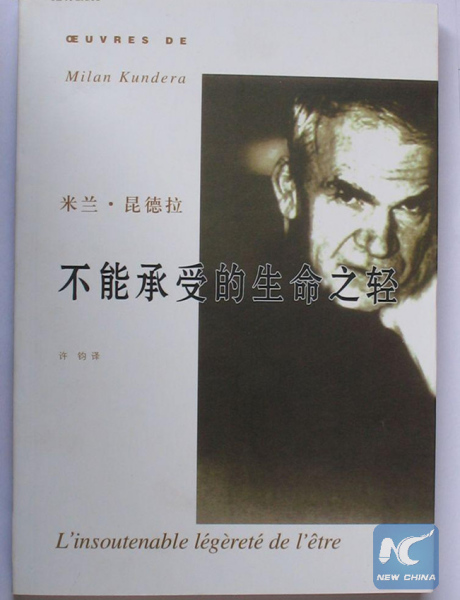 A file photo shows a Chinese version of the book The Unbearable Lightness of Being wrote by Czech author Milan Kundera. (Xinhua)