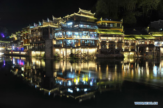 Photo taken on March 28, 2016 shows night view of Fenghuang Ancient Town, central China's Hunan Province. The Fenghuang Ancient Town, which was built in 1704, was added to the UNESCO World Heritage Tentative List in 2008. (Photo: Xinhua/Long Hongtao)