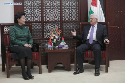 Visiting Chinese Vice Premier Liu Yandong (L) meets with Palestinian President Mahmoud Abbas in the West Bank city of Ramallah on March 31, 2016. China will implement the relevant initiatives raised by the Chinese president and continue to deepen mutual trust and enrich cooperation with Palestine, visiting Chinese Vice Premier Liu Yandong said here Thursday. (Xinhua/Fadi Arouri)