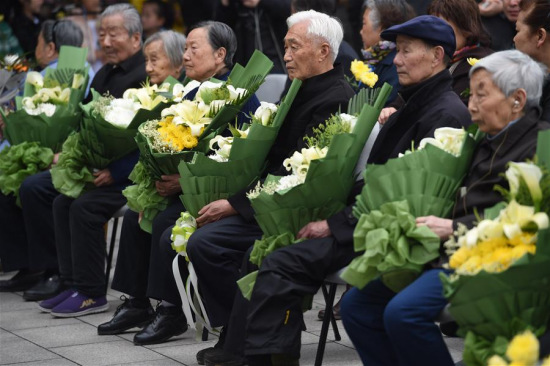Survivors of Nanjing Massacre attend a ceremony to mourn the Nanjing Massacre victims at the Memorial Hall of the Victims in Nanjing Massacre by Japanese Invaders on the Qingming Festival in Nanjing, capital of east China's Jiangsu Province, April 4, 2016. (Photo: Xinhua/Han Yuqing)