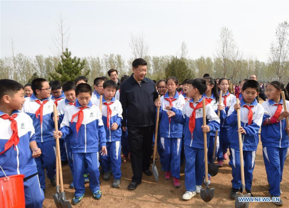 Chinese President Xi Jinping (C) walks with pupils after a tree-planting event in Xihongmen Township of Daxing District in Beijing, capital of China, April 5, 2016. Top leaders Xi Jinping, Li Keqiang, Zhang Dejiang, Yu Zhengsheng, Liu Yunshan, Wang Qishan and Zhang Gaoli attended a voluntary tree-planting in Beijing on Tuesday. (Photo: Xinhua/Li Xueren) 