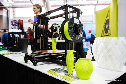 A 3D printer is working on a vase in the 2016 3D Print Week exhibition in Jacob Javits Convention Center in New York, the United States, March 11, 2016. The 3D print week will host a series of exhibitions, shows and keynotes, which aim to share the creative and professional opportunities within the 3D printing industry. (Photo: Xinhua/Li Changxiang)