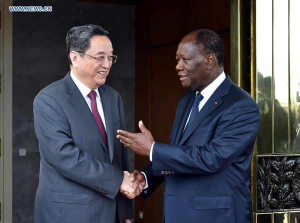 Yu Zhengsheng (L), chairman of the National Committee of the Chinese People's Political Consultative Conference, meets with Cote d'Ivoire's President Alassane Ouattara in Abidjan, Cote d'Ivoire, April 16, 2016. Yu paid an official visit to Cote d'Ivoire from April 13 to April 16 at the invitation of Cote d'Ivoire's Parliament Speaker Guillaume Soro. (Xinhua/Gao Jie)