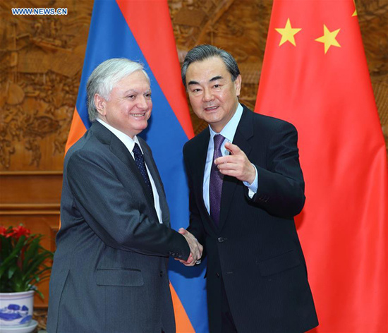 Chinese Foreign Minister Wang Yi (R) meets with Armenian Foreign Minister Edward Nalbandyan in Beijing, capital of China, April 15, 2016. On April 16, Nalbandyan and Secretary-General of the Shanghai Cooperation Organization (SCO) Rashid Olimov signed a memorandum marking Armenia's official status as a dialogue partner of the SCO. (Xinhua/Ding Haitao)