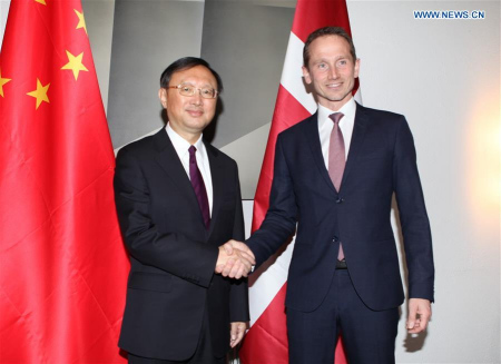 Visiting Chinese State Councilor Yang Jiechi (L) shakes hands with Danish Foreign Minister Kristian Jensen during their talks in Copenhagen, Denmark, April 16, 2016. Yang Jiechi held talks with Kristian Jensen here on Saturday, in which both sides agreed to push forward the comprehensive strategic partnership between the two countries. (Xinhua/Shi Shouhe)