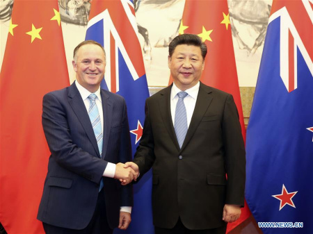 Chinese President Xi Jinping (R) meets with New Zealand Prime Minister John Key in Beijing, capital of China, April 19, 2016. (Photo: Xinhua/Ding Lin)