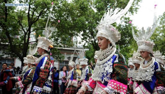 Women of Miao ethnic group attend a parade to celebrate the Miao Sisters Festival in Taijiang County, Miao-Dong Autonomous Prefecture of Qiandongnan, southwest China's Guizhou Province, April 20, 2016. The Miao Sisters Festival, regarded as the ethnic Miao's folk Valentine's Day, is held annually around the 15th day of the third lunar month according to the lunar calendar in China. (Xinhua/Tao Liang)
