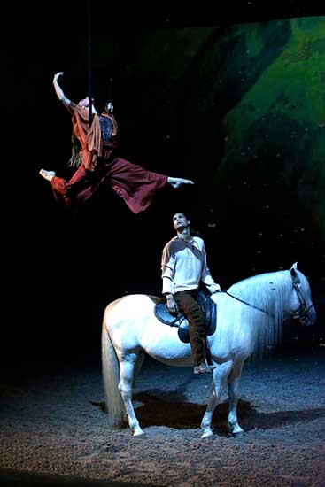 Cavalia is a multimedia spectacle which combines equestrian arts, dramatic visual effects, live music, dance and acrobatics. (Photo by Jiang Dong/China Daily)