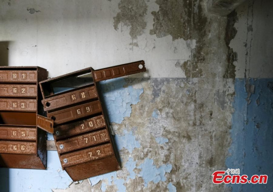 Mailboxes are seen in an apartment which was evacuated after an explosion at the Chernobyl nuclear power plant, in the ghost town of Pripyat, Ukraine, April 18, 2016. For residents of Chernobyl, a three-day evacuation turned into a thirty-year exile. Returning to their hometown of Pripyat on the eve of the anniversary, they recall their confusion and sacrifice in the wake of the world's worst nuclear accident. (Photo/Agencies)