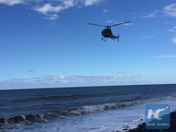 A helicopter searches over the sea on Reunion Island, on Jul.30, 2015. (Xinhua/Romain Latournerie) A helicopter searches over the sea on Reunion Island, on Jul.30, 2015. (Xinhua/Romain Latournerie)