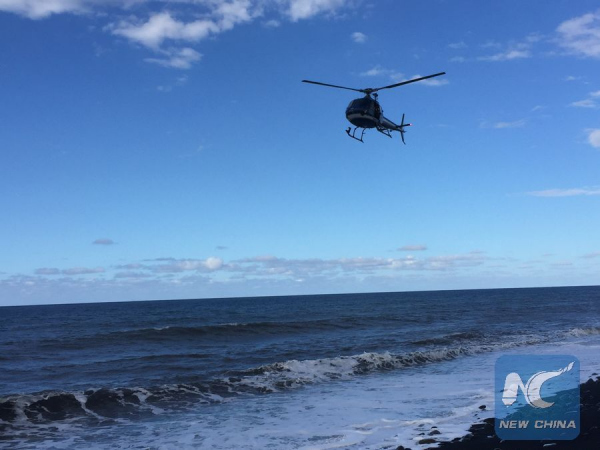 A helicopter searches over the sea on Reunion Island, on Jul.30, 2015. (Xinhua/Romain Latournerie)