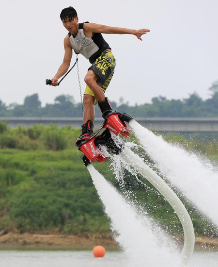 A man seen flyboarding, one of China's popular water sports, in Nanning, Guangxi Zhuang autonomous region. TAN KAIXING / FOR CHINA DAILY