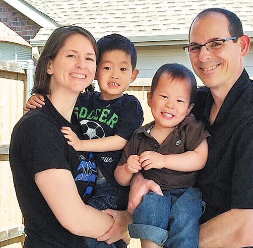 Michelle and Scott Morell with their two adopted Chinese sons, Ethan (left) from Anhui and Luke from Shaanxi. PROVIDED TO CHINA DAILY