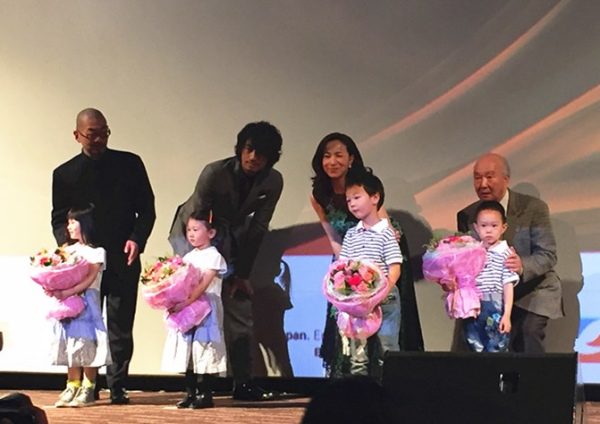 Japanese director Yoshihiro Nishimura, actor Takumi Saito, actress Meiko Harada and supervisor Masahiko Kumada pose at the opening ceremony of 2016 Japan Film Week. (Photo: Ecns.cn/Feng Shuang)