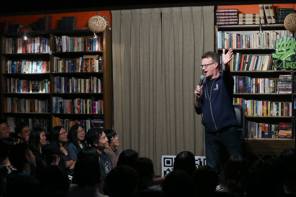 Rowswell often performs stand-up comedy shows at Beijing's Bookworm bookstore. (Photo by Jiang Dong/China Daily)
