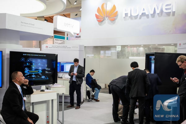 Staff members rest at Huawei's stand of the Hanover Fair in 2016 in Hanover, Germany, on April 26, 2016. Some 700 exhibitors from China, the second only to the host country in terms of the number of exhibitors, attended the fair. (Xinhua/Zhang Fan)